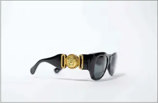  ?? COURTESY OF THE ROCK & ROLL HALL OF FAME ?? The Versace sunglasses of the late Notorious B.I.G. are on display at the Rock & Roll Hall of Fame in Cleveland. The rapper is one of the artists being inducted into the Rock Hall this year.