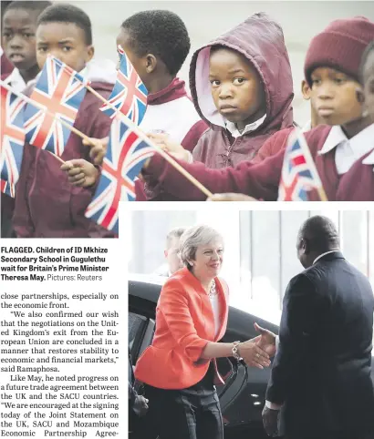  ?? Pictures: Reuters ?? FLAGGED. Children of ID Mkhize Secondary School in Gugulethu wait for Britain’s Prime Minister Theresa May. PLEASED TO MEET YOU. Britain’s Prime Minister Theresa May is greeted by President Cyril Ramaphosa in Cape Town yesterday.