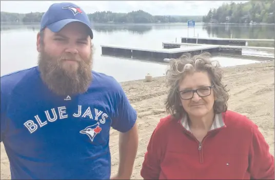  ?? MATTHEW MCCULLY ?? Ayer’s Cliff local Alex Marcotte and Everblue Massawippi Executive Director Michèle Gérin standing on the Ayer’s Cliff beachfront purchased recently by the Massawippi Regional Park Board. Under the company name Marina Massawippi, Marcotte and Everblue...