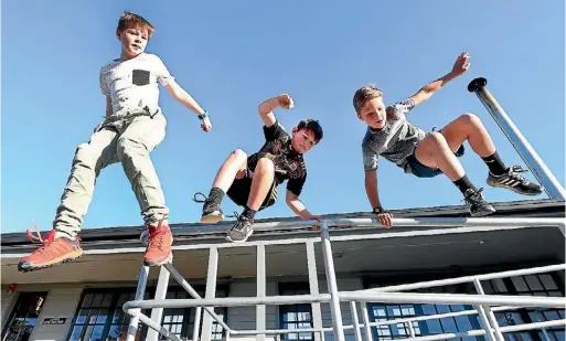  ?? PHOTO: SCOTT HAMMOND/FAIRFAX NZ ?? Getting the knack of parkour are, from left, Conlan Purdie, 12, Gibson Purdie, 10, and Jack MacLean, 10, before a profession­al clinic next week.