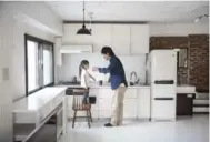  ?? SHIHO FUKADA FOR THE WASHINGTON POST ?? Naoki Numahata and his daughter Ei, 4, in their 420-square-foot apartment.