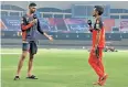  ??  ?? Devdutt Padikkal (left) has a chat with Yuzvendra Chahal
