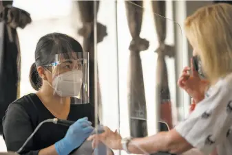  ?? Sara Gobets / Special to The Chronicle ?? Tracy Tran gives Candice Gundersen a manicure at La Orquidea Salon and Spa in Los Gatos.