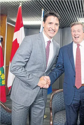  ??  ?? Prime Minister Justin Trudeau’s pleasant exchange with Mayor John Tory was markedly different than his meeting with Doug Ford on Thursday.