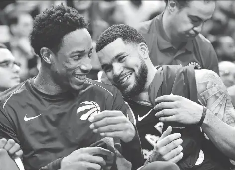  ?? FRANK GUNN/THE CANADIAN PRESS ?? Raptors guards DeMar DeRozan and Fred VanVleet share a laugh late in their 133-99 rout of the Cleveland Cavaliers in Toronto, Thursday. The Raps, without starters Kyle Lowry and Serge Ibaka, got a career-high 22 points from VanVleet and a modest 13...