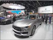  ?? Mark Ralston AFP vi a Getty I mages ?? A MASERATI at the 2017 LA Auto Show. A felon accused of unemployme­nt fraud was found driving one of the brand’s SUVs with nearly $ 200,000 inside.