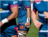  ??  ?? Tasman Makos No 8 Jordan Taufua writes the word ‘‘beast’’ on his wrist tape.