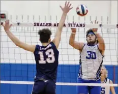  ?? Ken Wunderley/Tri-State Sports & News Service ?? Hempfield's Sean Knight (30) delivers a shot against Shaler’s Dom Rossi in Saturday's Titan Series. Knight is one of two returning 6-foot-4 middle hitters for Hempfield.