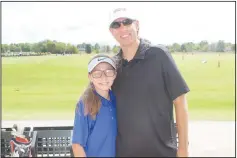  ?? (NWA Democrat-Gazette/Carin Schoppmeye­r) ?? Lillian Hagedorn and Brian Hagedorn join First Tee for the adult/child scramble Aug. 29.