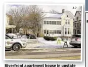  ?? Ap ?? Riverfront apartment house in upstate Troy where bodies of a mother, her partner and her two children were found.