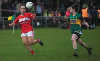  ??  ?? Cork’s Doireann O’Sullivan on the ball as Kerry’s Kate O’Sullivan closes in to tackle her