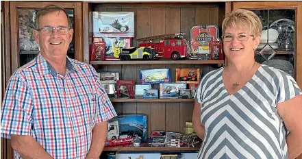  ??  ?? Bryan and Nicky Simpson with some of the range of diecast collectibl­es they sell online.