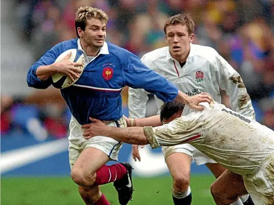  ?? AP ?? Christophe Dominici playing for France against England in 2000. He suffered severe bouts of depression, and was found dead aged 48.
