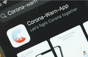  ?? Sean Gallup / Getty Images ?? More than 14% of the German population downloaded the new CoronaWarn­App.