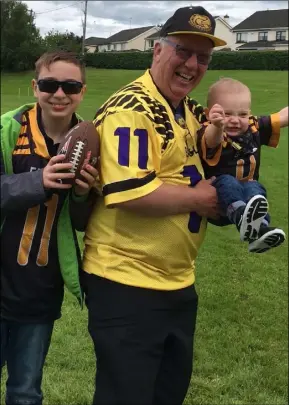  ??  ?? Kevin Klatt savouring an Eagles victory with grandsons Ryan (left) and Gearóid.