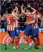  ?? Reuters ?? ON TARGET: Atletico’s Joao Felix celebrates after scoring their third goal with his teammates. —