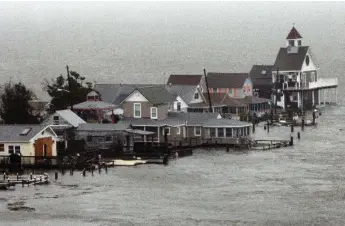  ?? DALE GERHARD/THE ASSOCIATED PRESS FILE PHOTO ?? Hurricane Sandy in 2012 highlighte­d the risk for the shoreline around New York and other northern states.