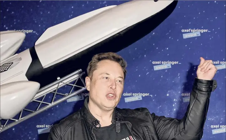  ?? Britta Pedersen / Associated Press ?? Spacex owner and Tesla CEO, Elon Musk arrives on the red carpet for the Axel Springer media award Dec. 1 in Berlin.