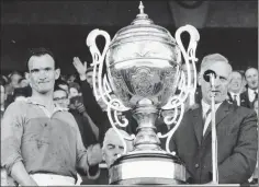  ??  ?? A proud Tom Neville accepts the Bob O’Keeffe Cup as Wexford captain after Wexford defeated Kilkenny in the Leinster hurling final of 1965.