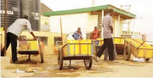  ??  ?? Water vendors fetching water to sell, at Yelwa Community, in Bauchi