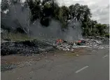  ??  ?? Rubbish being burnt in the open in Malaysia, where some New Zealand recycling is being dumped.
