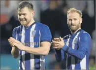  ??  ?? CUP JOY: Sheffield Wednesday pair Jordan Thorniley and Barry Bannan, right, celebrate their victory over Luton Town on Tuesday.