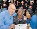  ?? Picture: MIKE HOLMES ?? GIVING BACK: At the certificat­e awards ceremony yesterday are, from left, facilitato­r John Preller, Joycelyn Moses, 25, the youngest recipient, and group leader Hendrina Potgieter