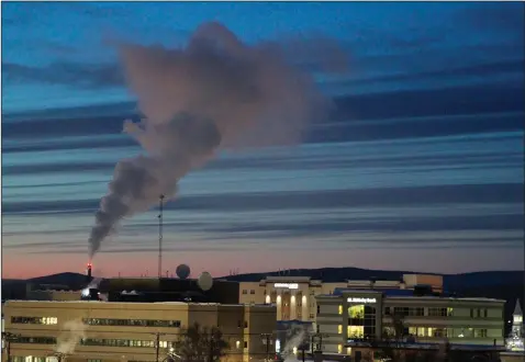  ?? (File Photo/AP/Mark Thiessen) ?? A plume of smoke is emitted into the air Feb. 16 from a power plant in Fairbanks, Alaska, which has some of the worst polluted winter air in the United States.