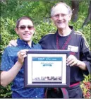  ?? BARB AGUIAR/Westside Weekly ?? Mihai Caveros poses with Master Michael Smith, who has received the 2021 Difference Maker of the Year award for B.C. Caveros.