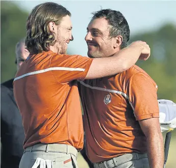  ??  ?? Europe’s Tommy Fleetwood, left, and Francesco Molinari.