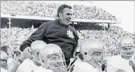  ?? Associated Press ?? COLLEGE FOOTBALL HALL OF FAMER Notre Dame coach Ara Parseghian is carried off the field by his players after beating Texas in the 1971 Cotton Bowl.