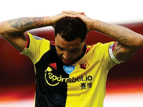  ?? (PA) ?? Captain Troy Deeney reacts to the Hornets’ defeat