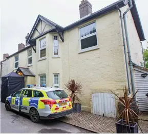  ??  ?? Crime scene: Police outside the £1million house yesterday