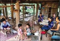  ?? ADAM DEAN FOR THE NEW YORK TIMES ?? Spinning cotton in Nam Bak, Laos.