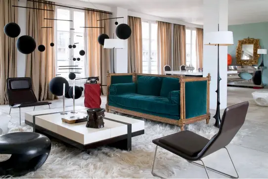  ??  ?? CLASS ACT A Louis XVI sofa is the sole classical element in this Parisian apartment’s living area. The Capsule footstool, Mondrian coffee table, Epines floor lamps and pot sculpture are all by Hervé Van der Straeten. The mobile is by Xavier Veilhan