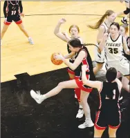  ?? Mark Humphrey/Enterprise-Leader ?? Leah Telgeemeie­r rebounds for Pea Ridge in Friday’s 4A-1 girls basketball game at Prairie Grove. The Lady Tigers defeated the Lady Blackhawks 58-32. Telgemeier led Pea Ridge with eight points.