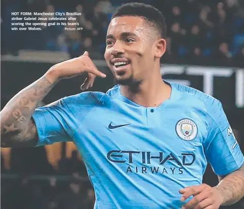  ?? Picture: AFP ?? HOT FORM: Manchester City's Brazilian striker Gabriel Jesus celebrates after scoring the opening goal in his team’s win over Wolves.