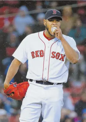  ?? AP PHOTO ?? LOAD OF TROUBLE: Eduardo Rodriguez reacts after walking in a run during the Red Sox’ 10-6 victory against the Royals last night at Fenway.