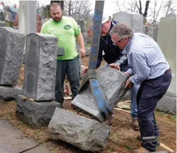 ?? (Reuters) ?? TOPPLED JEWISH headstones after a weekend vandalism attack on Chesed Shel Emeth Cemetery in University City, a suburb of St Louis, Missouri last month.