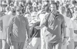  ?? MARK WALLHEISER/AP ?? Miami Hurricanes coach Manny Diaz (right) and safeties coach/co-defensive coordinato­r coach Ephraim Banda (left) during UM’s game at Florida State on Nov. 2.