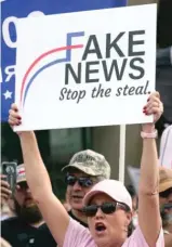  ?? LM OTERO/ AP ?? A supporter of President Donald Trump holds a sign during a rally last month in Dallas.