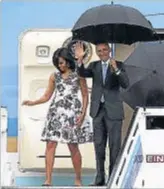  ?? JOE RAEDLE / GETTY IMAGES ?? La lluvia recibió a Obama y su familia