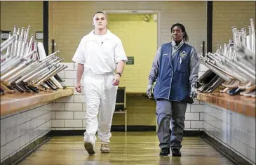  ?? JAY JANNER / AMERICAN-STATESMAN ?? Greg Kelley enters the visitation area Wednesday at the Wynne Unit prison. “I don’t know what freedom feels like anymore . ... I just want my life back,” said Kelley, who is serving a 25-year sentence.