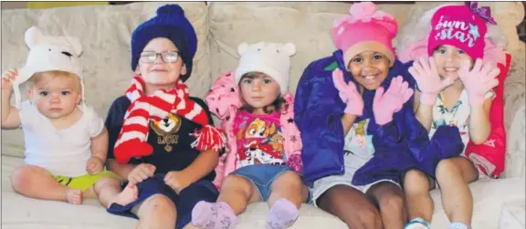  ?? SUBMITTED PHOTO ?? Jayden Kieffer, Nick Hogan, Avery Kieffer, Ellie Schwerdtfe­ger and Bria Gentile enthusiast­ically model some of the winter accessorie­s already donated to the 2020 Operation Warm drive organized by Grands Stepping Up.