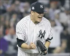  ?? David J. Phlllip/Associated Press ?? Masahiro Tanaka reacts after one of his eight strikeouts.