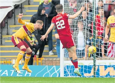  ??  ?? Kevin Van Veen heads home Motherwell’s opener, adding to Aberdeen’s frustratio­ns