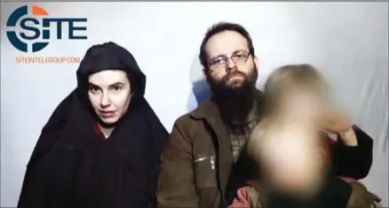  ?? SITE/AFP ?? In this undated video grab provided by Site Intelligen­ce Group and released by AFP on October 12, hostages Caitlan Coleman (left) and Joshua Boyle speak to the camera holding their children in an undisclose­d location.
