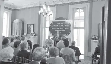  ?? PHOTO BY PAUL LEACH ?? Andrew Hunt, director of the Cleveland Bradley County Public Library, speaks to a group of nearly 50 people recently at the renaming of the History Branch as the Johnston Tucker Center.