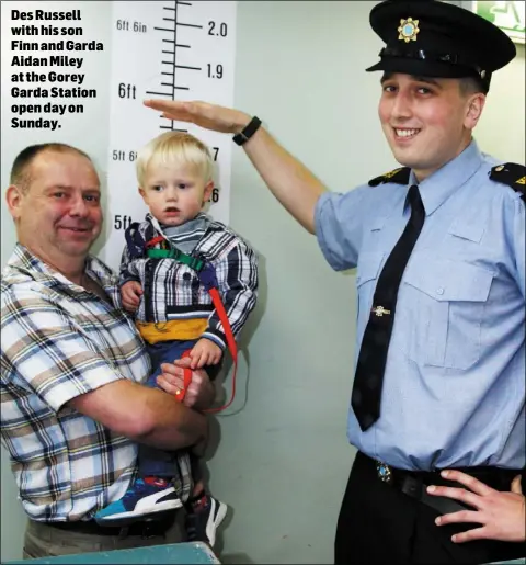  ??  ?? Des Russell with his son Finn and Garda Aidan Miley at the Gorey Garda Station open day on Sunday.