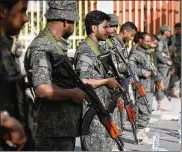  ?? HANI MOHAMMED / AP ?? Yemeni Shiite fighters stand guard during a protest against U.S. President Donald Trump’s Mideast plan in Sanaa, Yemen on Jan. 31.